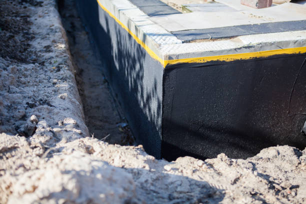 Professional Waterproofing technician working in Evanston, IL